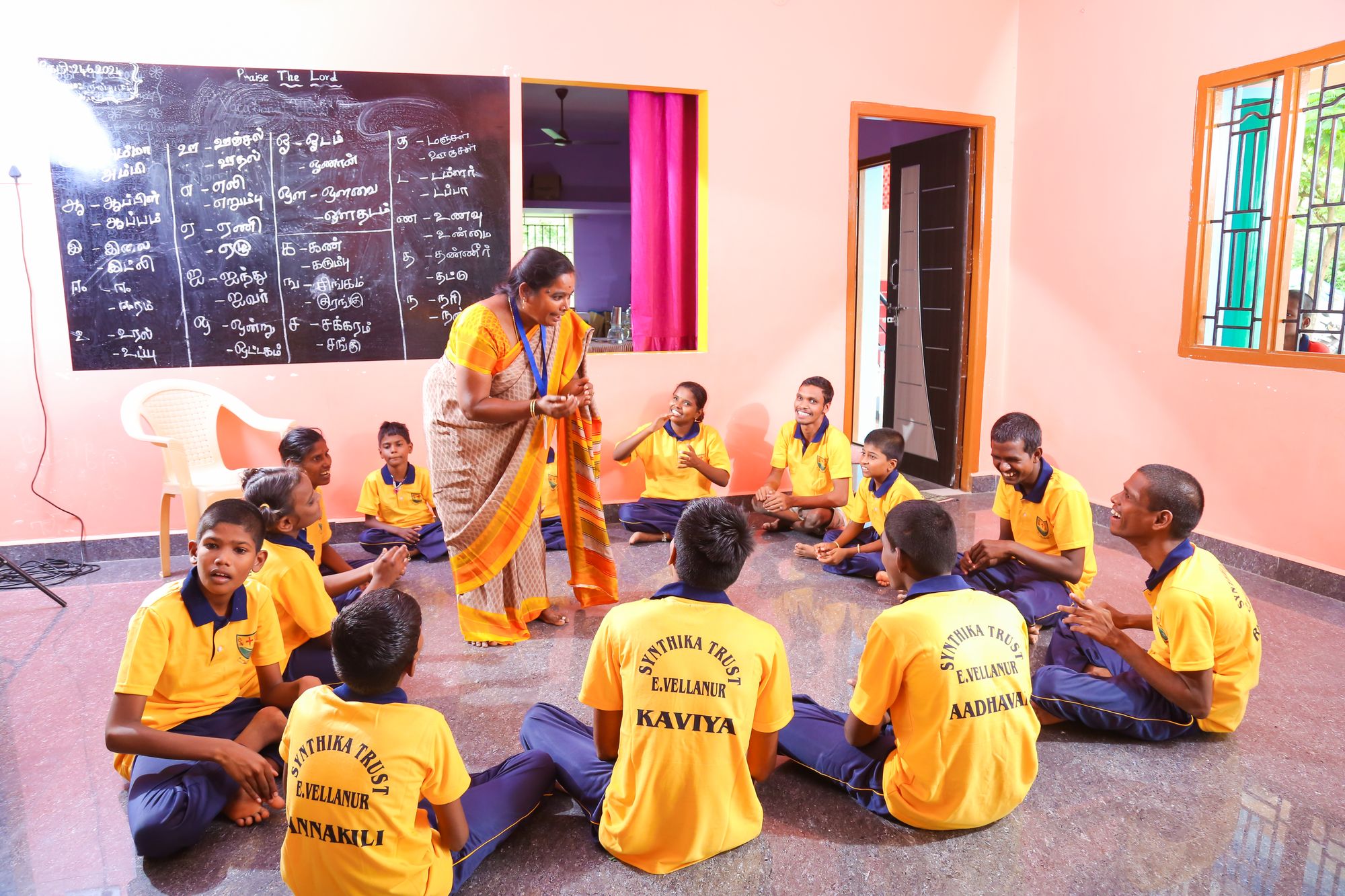 Teacher leading a group activity in a classroom